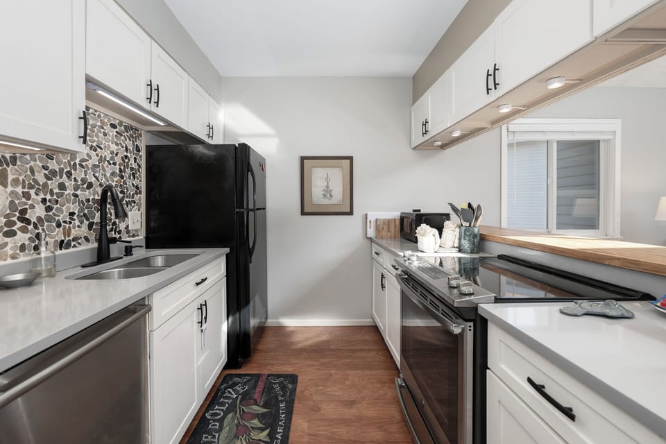 Your fully equipped kitchen awaits with gleaming countertops, modern appliances, and everything you need to create memorable meals during your stay.