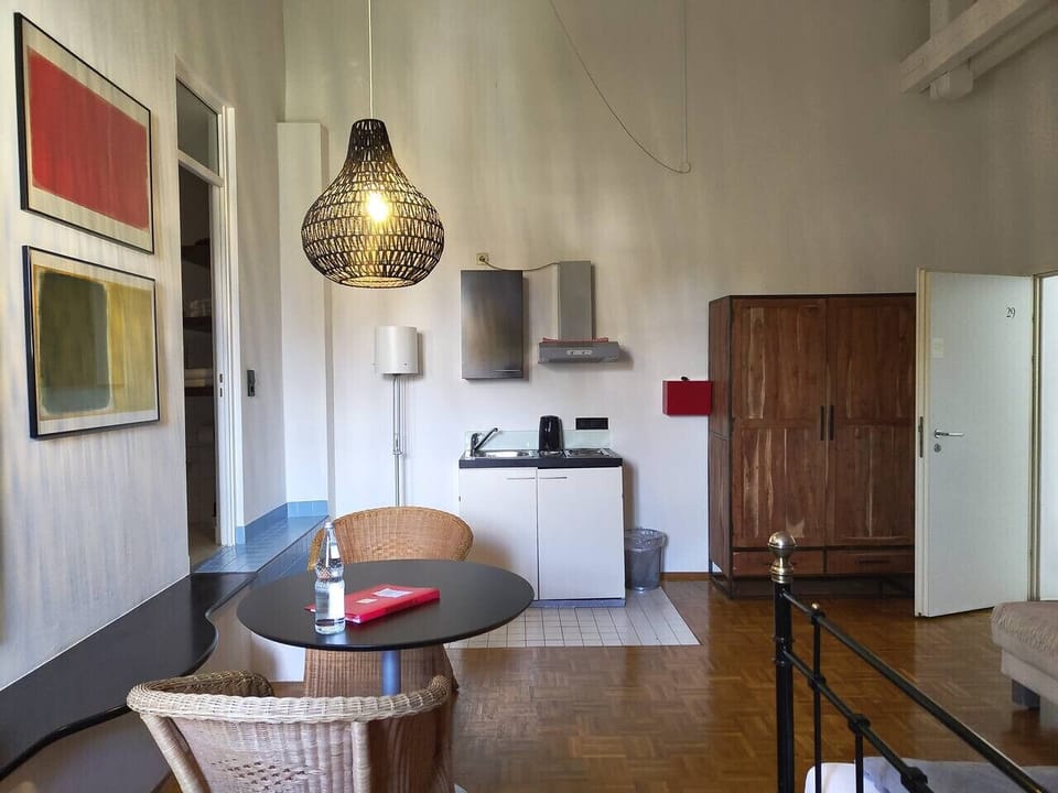 Spacious loft studio with bed and dining area