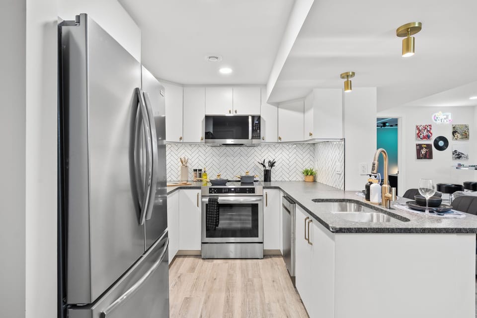 Bright and fully equipped kitchen with stainless steel appliances, spacious counters, and everything you need for easy cooking.