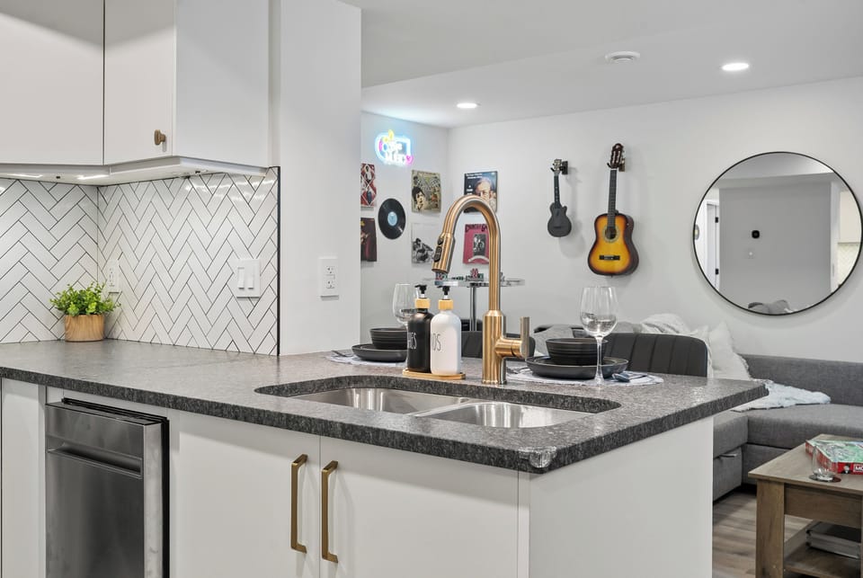 Modern kitchen vibes with bold gold accents and cozy charm for unforgettable gatherings.