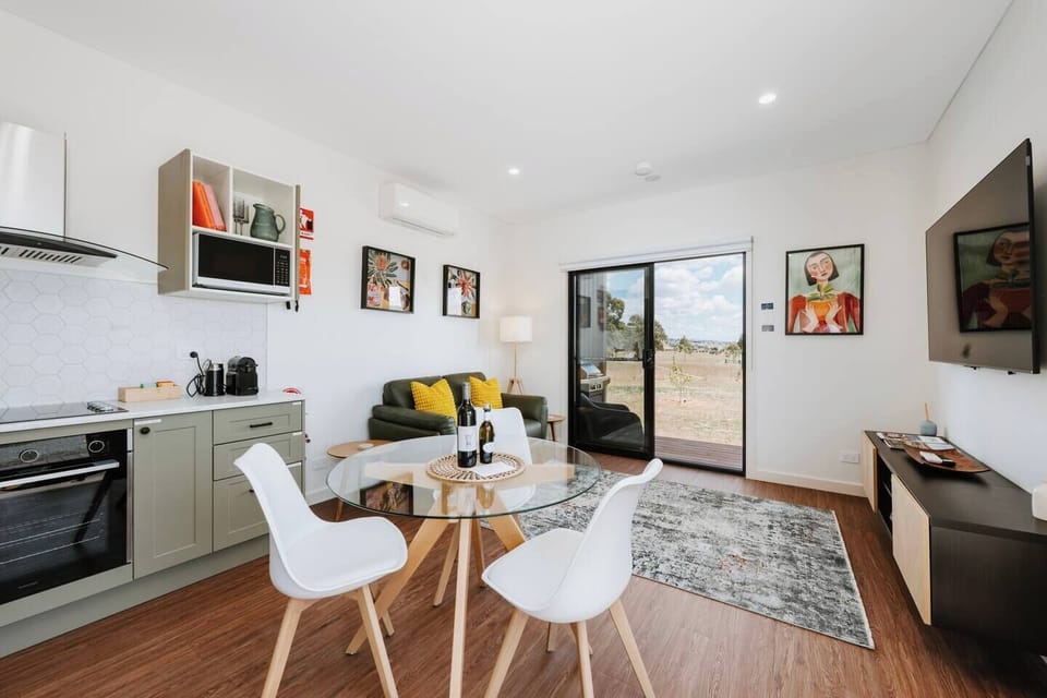 Gather for casual breakfasts or a shared bottle of local wine at Sevillano Cottage's dining table—an inviting space to unwind and reconnect after a day in the countryside.