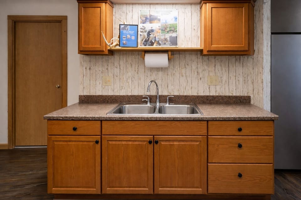 Guest house sink area with clean counter space and essentials for a comfortable stay.