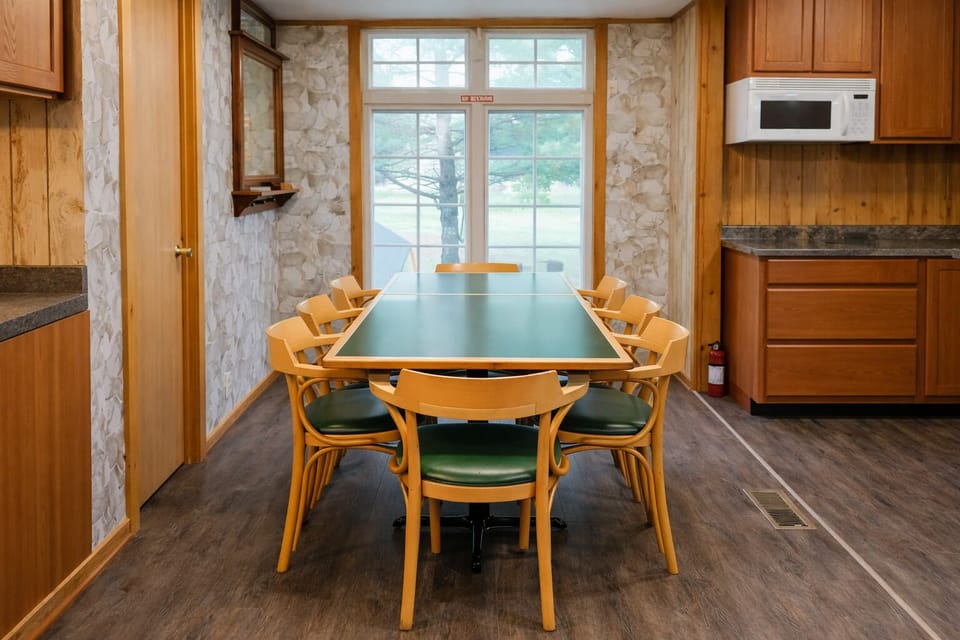 Guest house dining area with a comfortable table for shared meals and relaxed country gatherings.