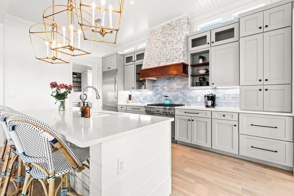 The gourmet kitchen features high-end appliances