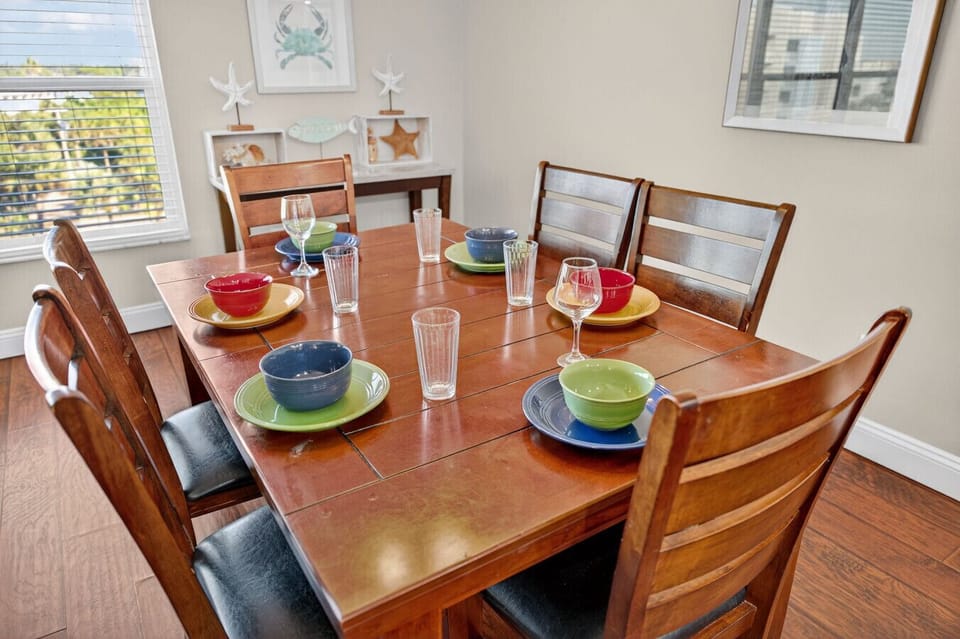 Welcoming dining table set for shared meals, perfect for gathering over good food & conversation.