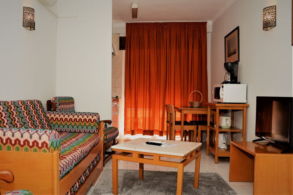 Apartment, 1 Bedroom, Balcony (for 2 people) | Living room | Flat-screen TV