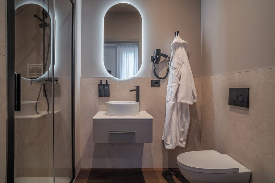 Shower, free toiletries, hair dryer, slippers