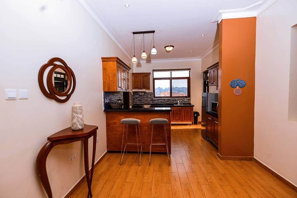 Warm and inviting atmosphere leading into an open kitchen.