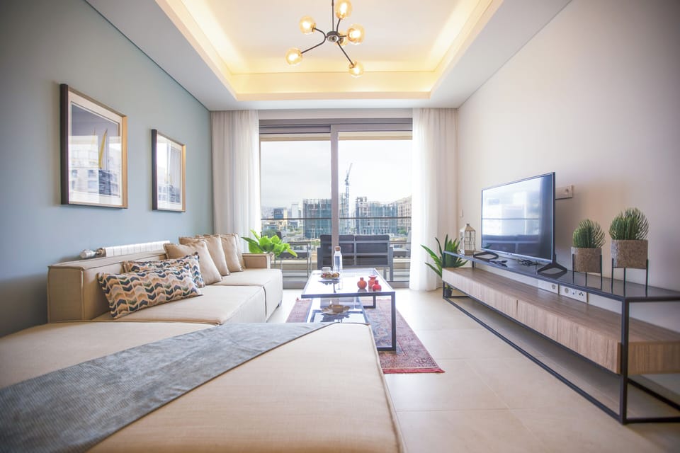 Apartment, 2 Bedrooms, Kitchen, City View | Living room | 55-inch Smart TV with cable channels, streaming services