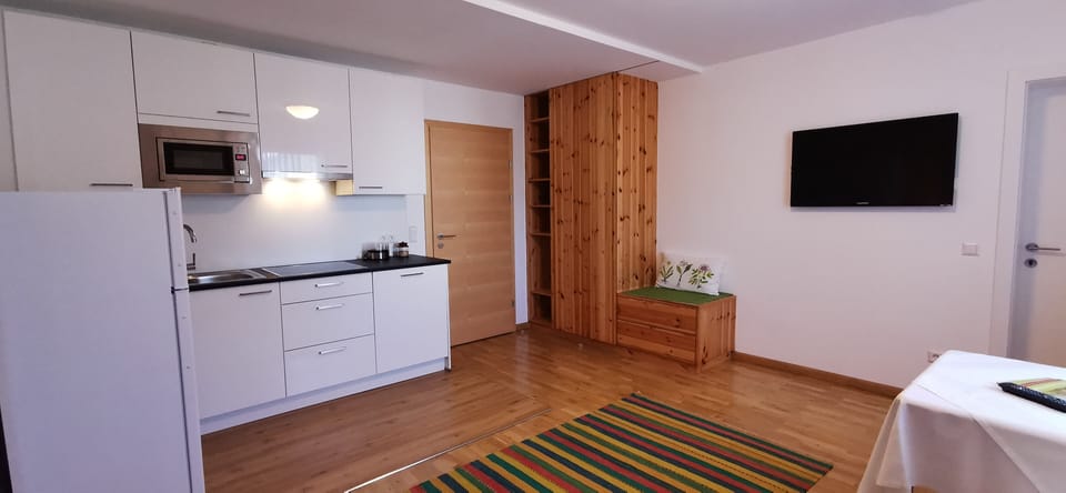 Apartment, 1 Bedroom | Living area | 102-cm flat-screen TV with satellite channels, TV