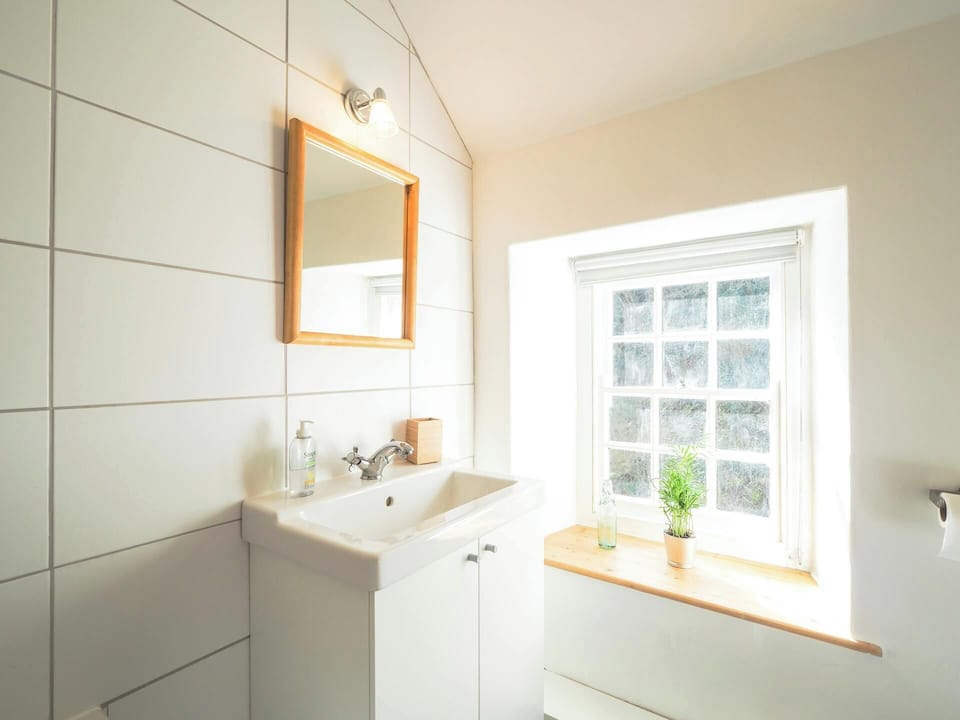 Window and hand basin with mirror above
