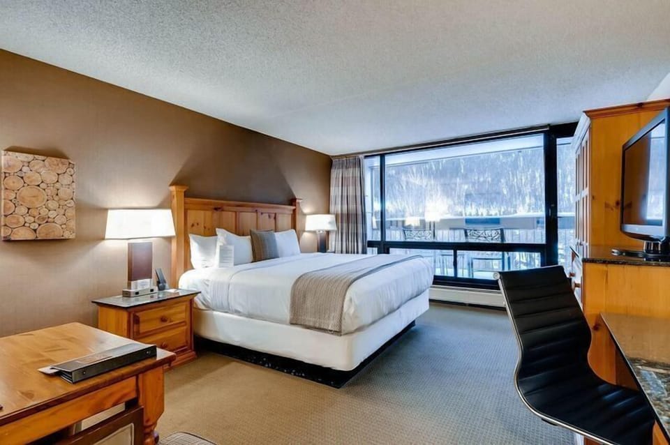 The well-appointed bedroom offers a harmonious blend of comfort and style, where the serene ambiance ensures a perfect night's sleep after a day of adventure.