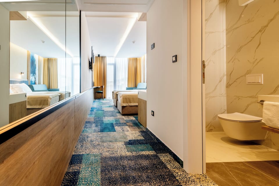 Deluxe Double or Twin Room, 1 Bedroom, Sea View | In-room safe, desk, laptop workspace, blackout drapes