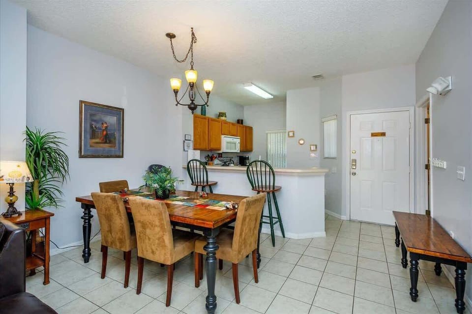 Ground Level | Open Dining Space | Elegant Lighting + Tile Floors
Enjoy family meals or special moments under a stylish chandelier, with easy access to the kitchen and ample room for group dining.