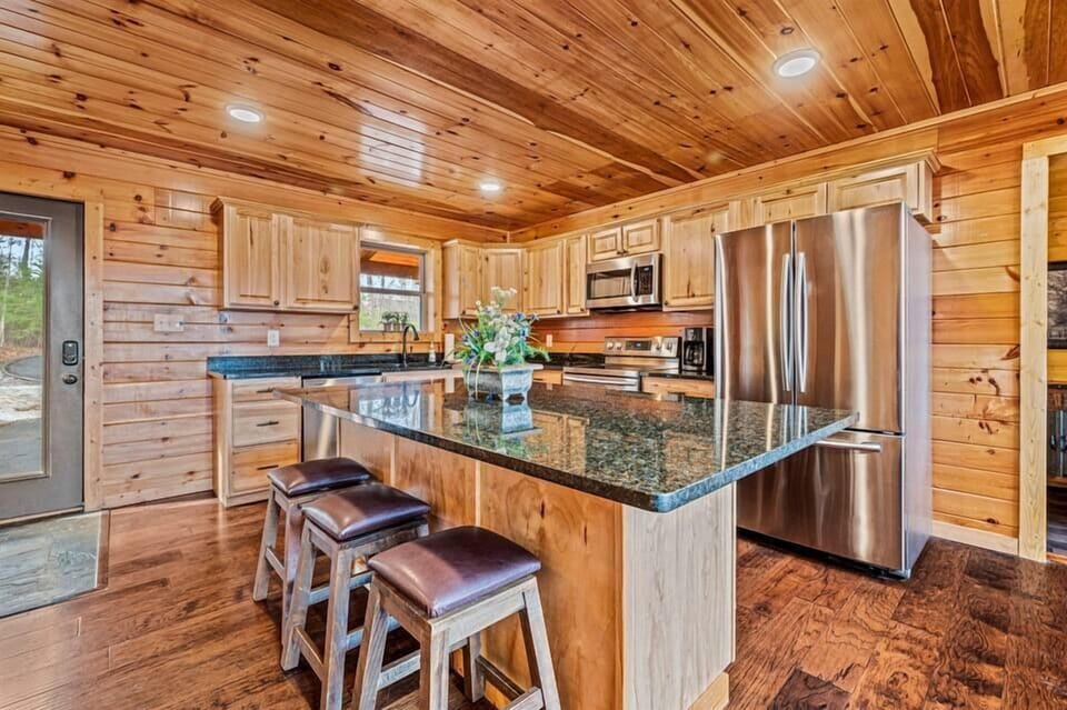 Your hub for culinary delights and cozy living—open kitchen with table and views
