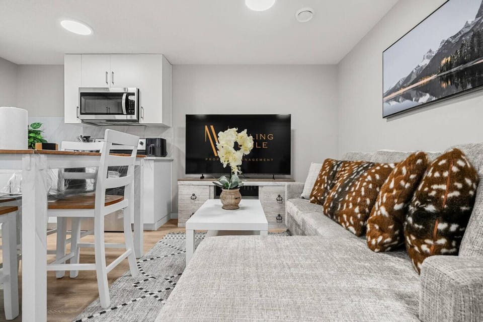 Living room with a Smart TV & cozy sectional.