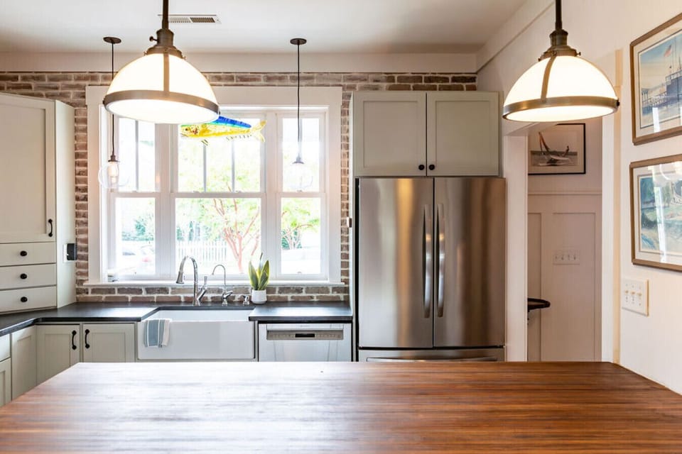 The kitchen at Promise Point is as functional as it is beautiful, with high-end design, open flow, and island seating.