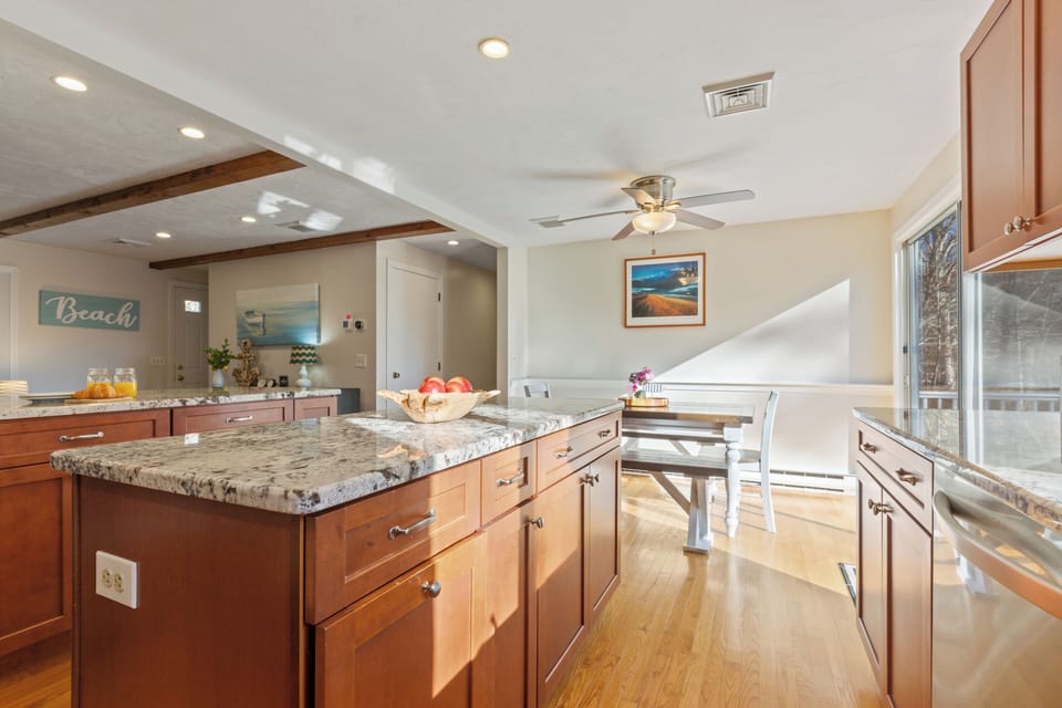 Enjoy the spacious island and breakfast bar for easy meal prep and casual dining