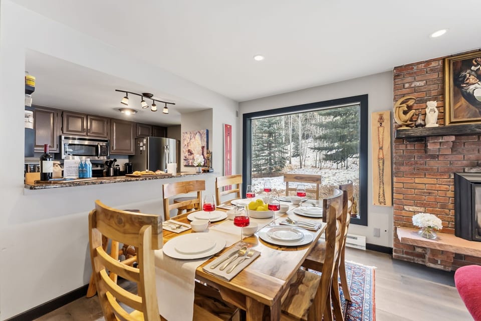 Dining area: Dining table with 7 seats, 2 barstools