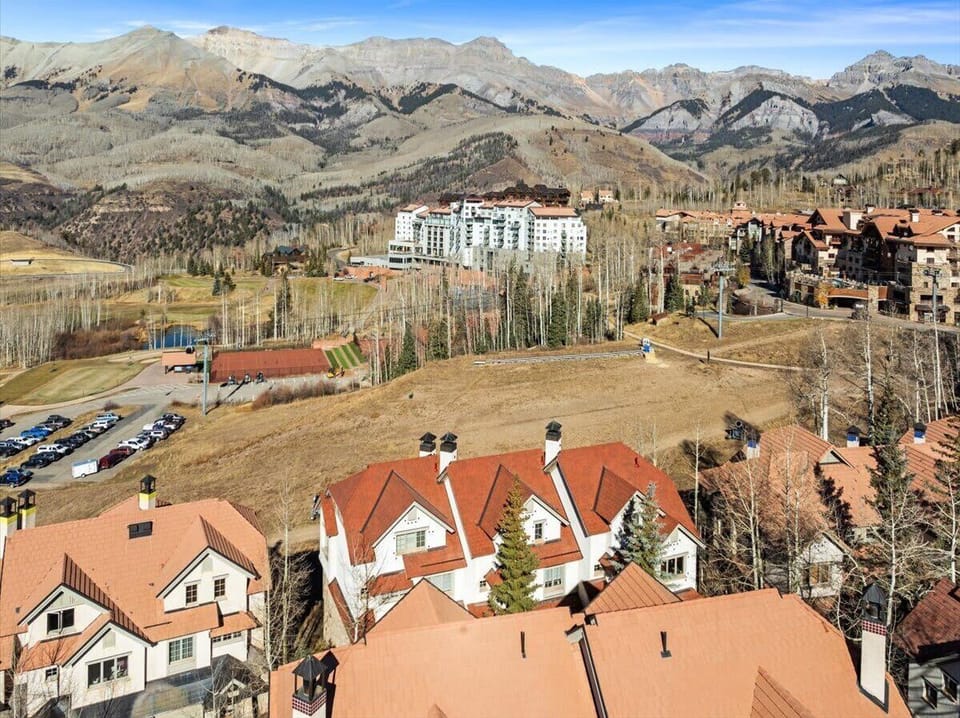 An aerial view of the townhome and slopes.