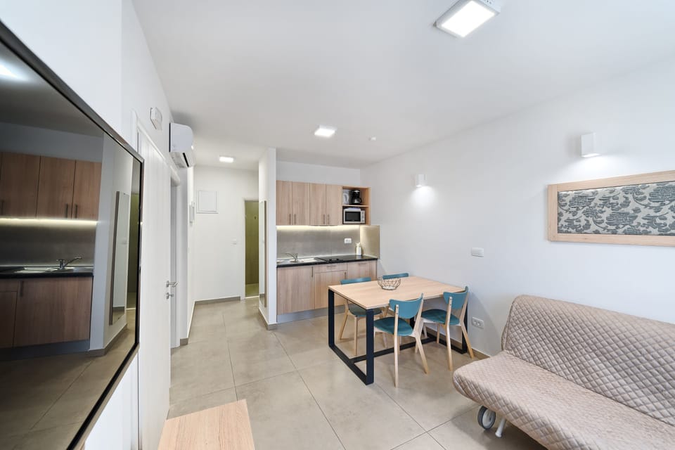 Superior Apartment, 1 Bedroom, Patio | Living room | TV