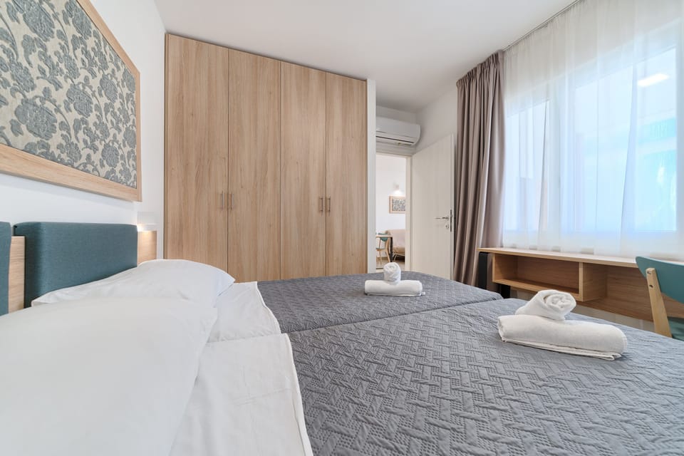 Desk, laptop workspace, free WiFi, bed sheets