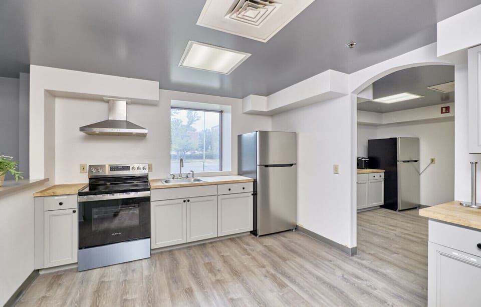 Community Kitchen with range and Fridge