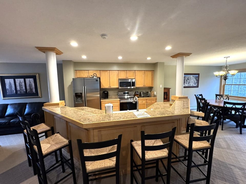 Fully equipped kitchen open to dining area. Seats 6