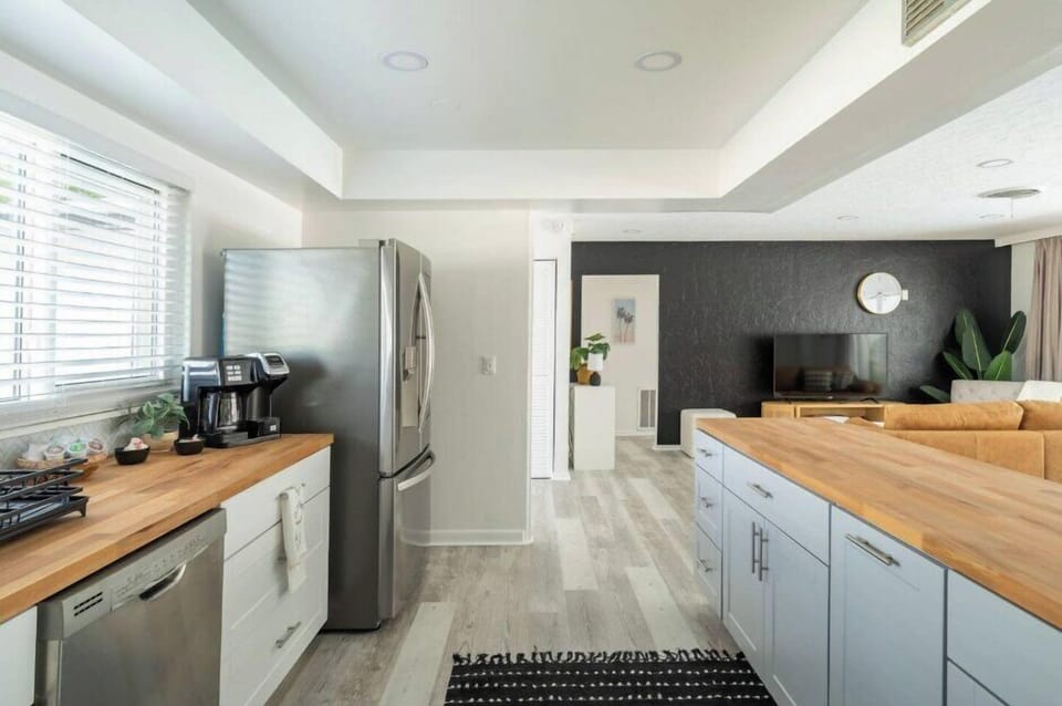 Modern appliances including a fridge, dishwasher, electric stove, and more!