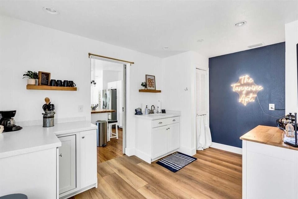 Kitchenette area with a dishwasher, sink, and small countertop space.