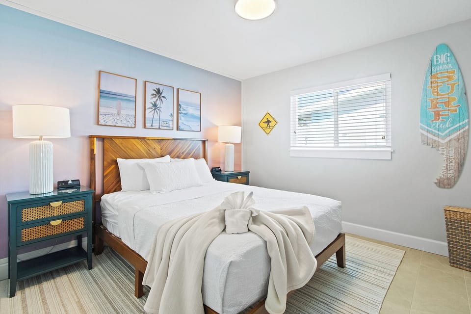 Guest bedroom 1 features a plush queen bed