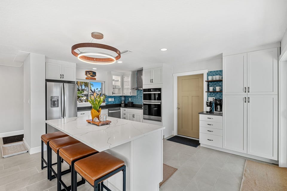 Sleek & modern kitchen with breakfast bar that seats four
