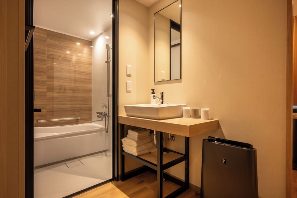 Superior Twin Room | Bathroom | Hair dryer, slippers, towels, soap