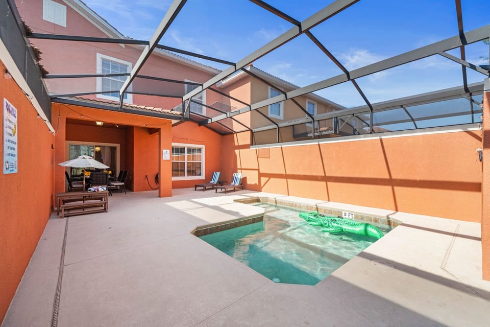 Spacious lanai living: private splash pool, sunny loungers, and covered alfresco dining-your family's favorite Florida hangout.