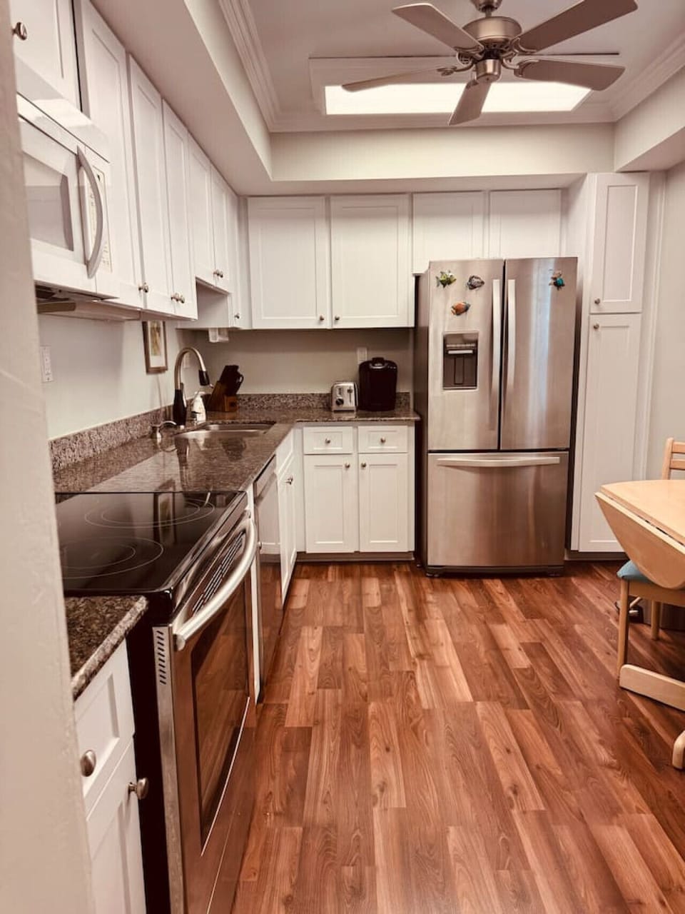 Fully equipped kitchen with stainless steel appliances and a Keurig for easy mornings.