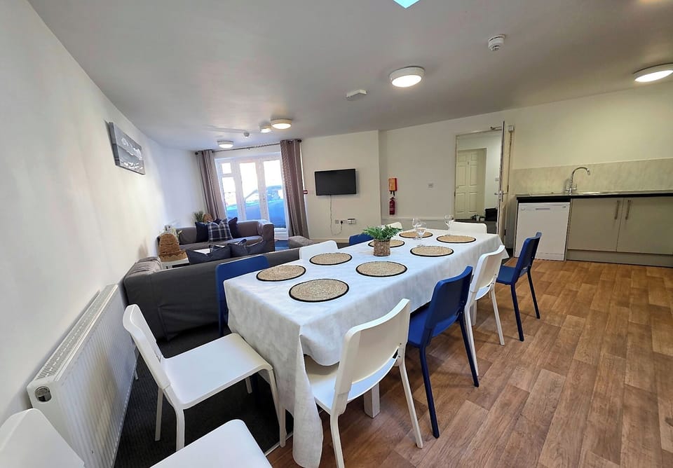 Bright open plan dining area into the kitchen and lounge, located on the ground floor.