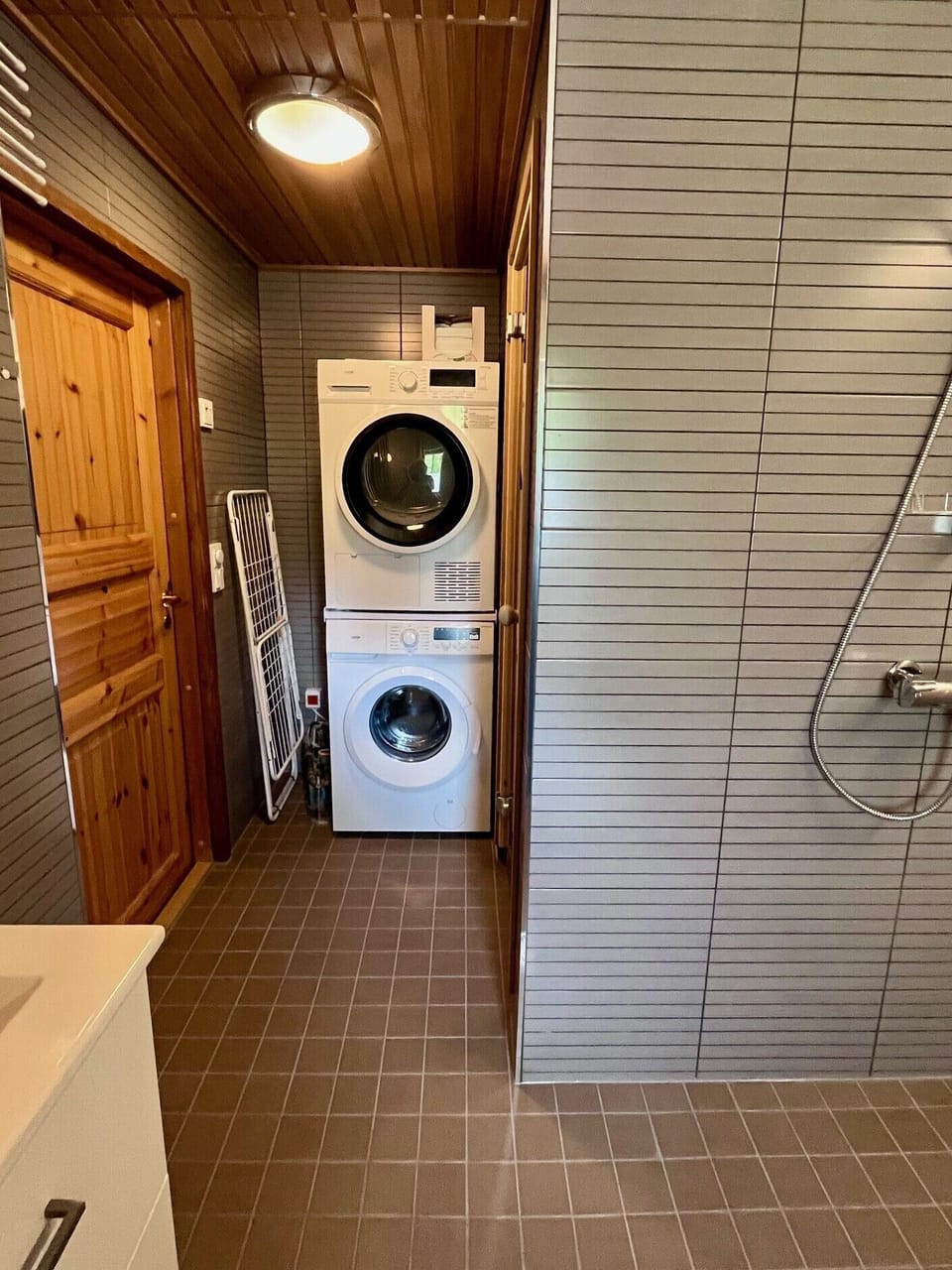 Bathroom with washing and drying machines