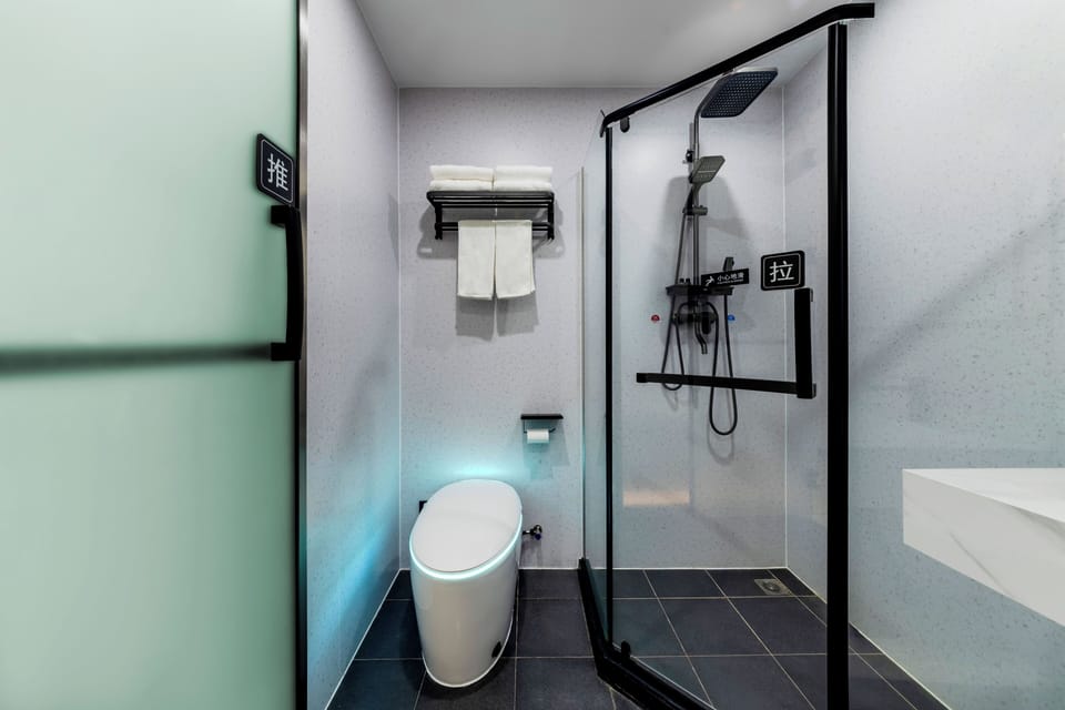 Shower, free toiletries, hair dryer, slippers