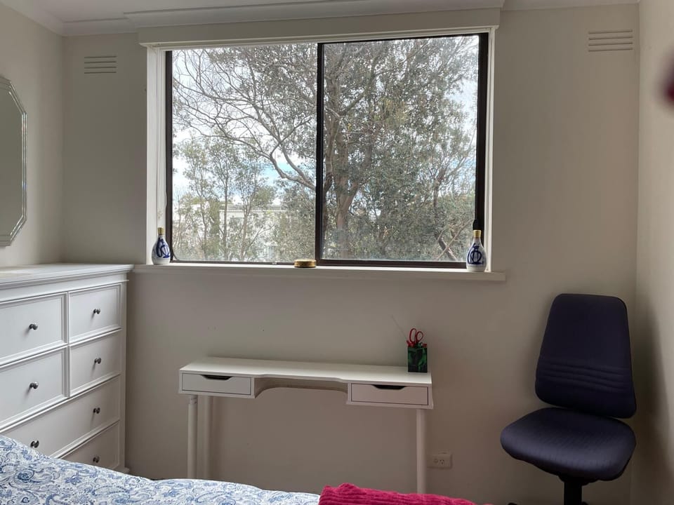 Possible position for portable mini desk in queen bedroom