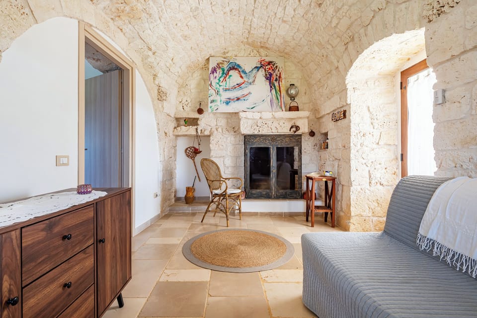 Family Villa, Multiple Bedrooms (Trullo ConoSolo With Pool) | Living area | 21-inch Smart TV with digital channels, fireplace