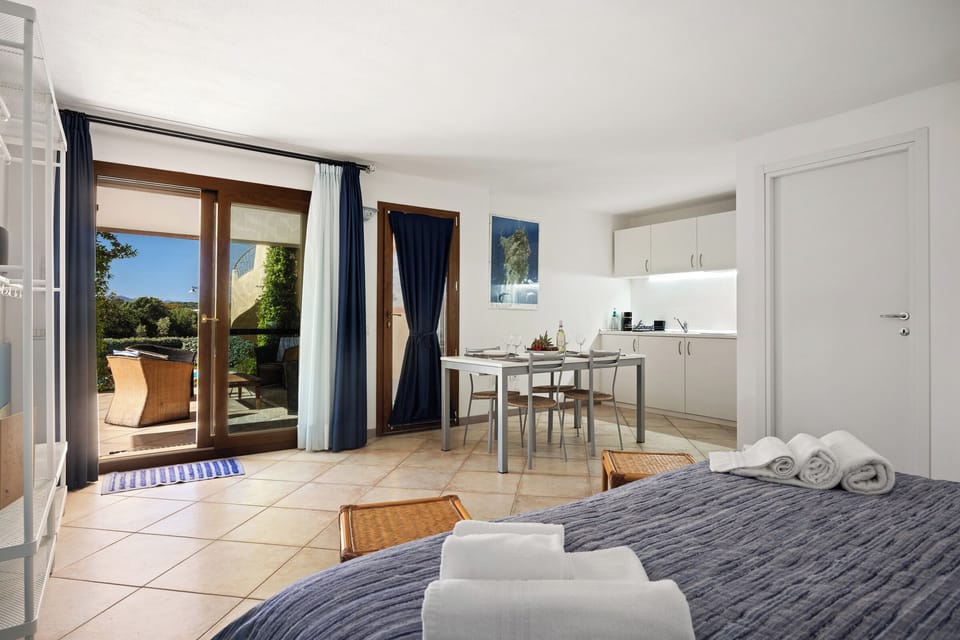 Comfort Room, Pool View | Minibar, individually furnished, blackout drapes, iron/ironing board