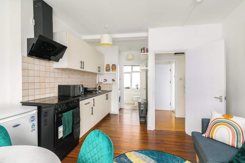 Spacious open-plan living and kitchen with contemporary decor and full amenities