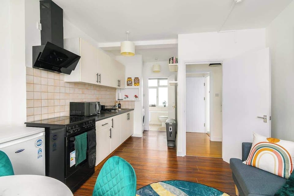 Spacious open-plan living and kitchen with contemporary decor and full amenities