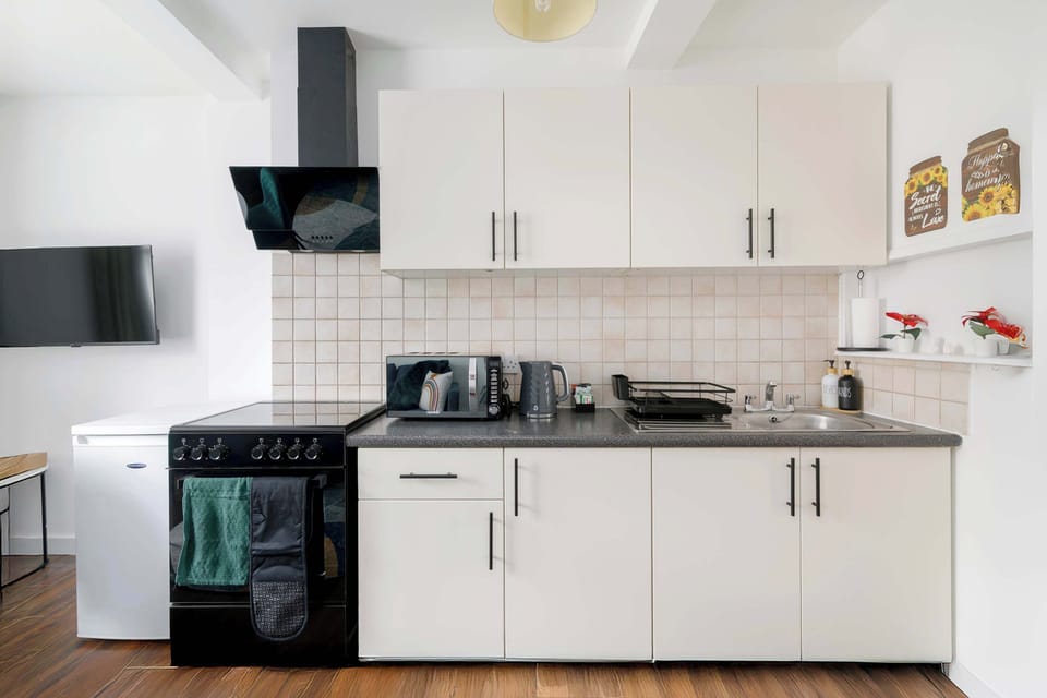 Relax and cook together in this bright open-plan living and kitchen space