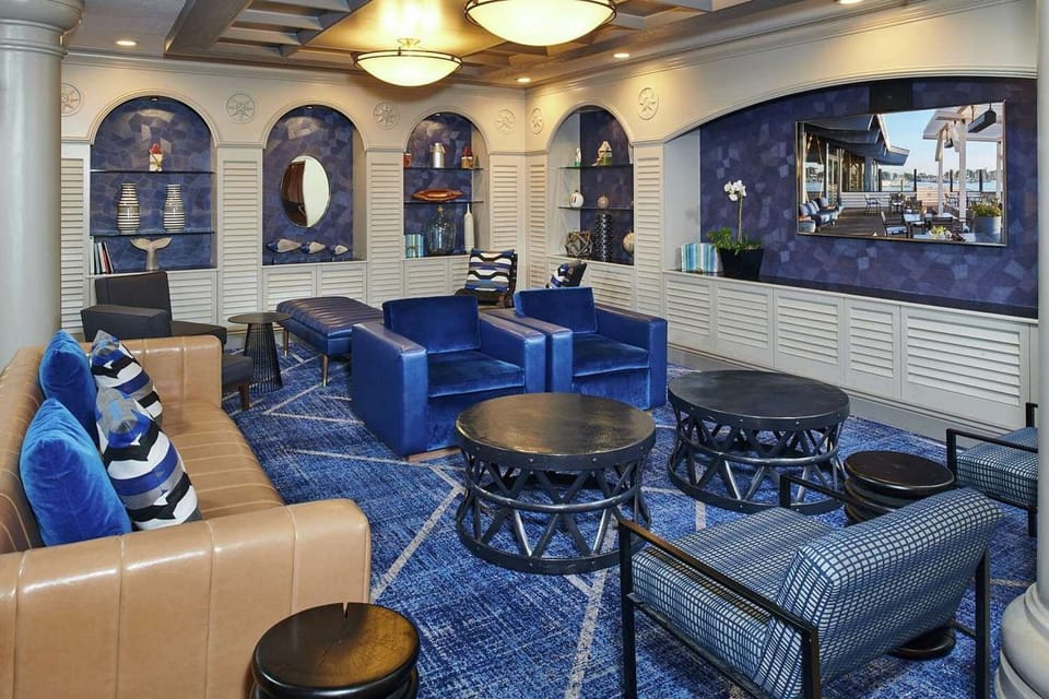 Cozy seating space with blue chairs and shelves for relaxing