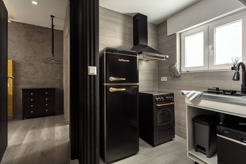 Deluxe Studio Suite, Pool View | Private kitchenette | Espresso maker, highchair