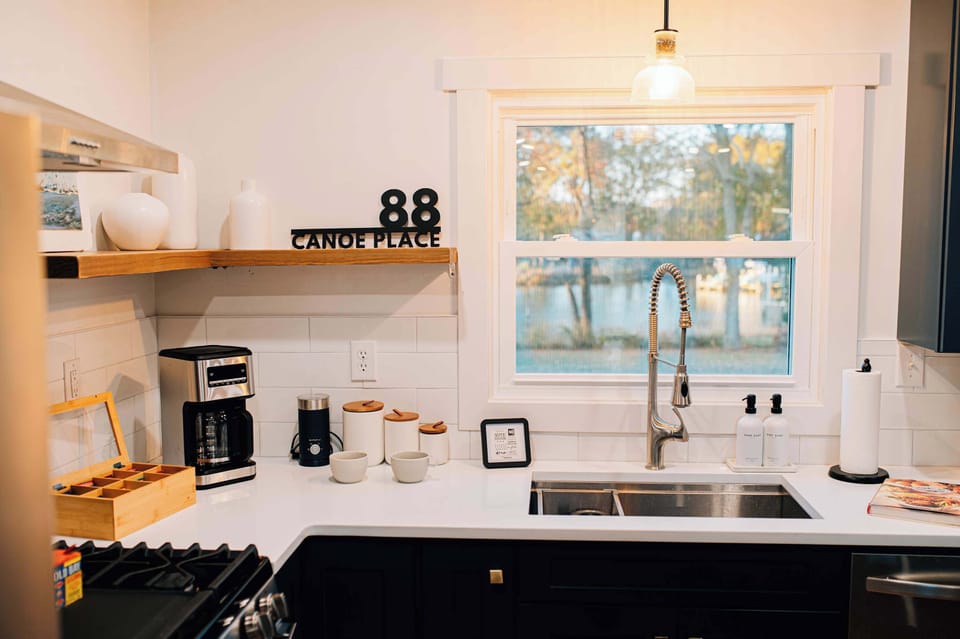 A bright, peaceful kitchen where mornings start slowly—brew coffee, take in creek views, and ease into the day. Thoughtfully stocked and beautifully styled for relaxed family cooking.