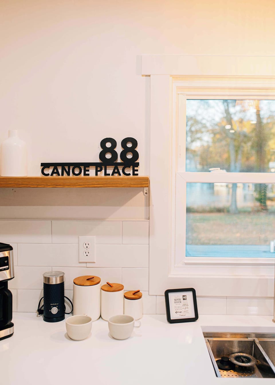 Morning coffee feels extra peaceful here—clean counters, warm light, and quiet views over the creek. Thoughtful touches make this corner a calm, inviting start to each day.