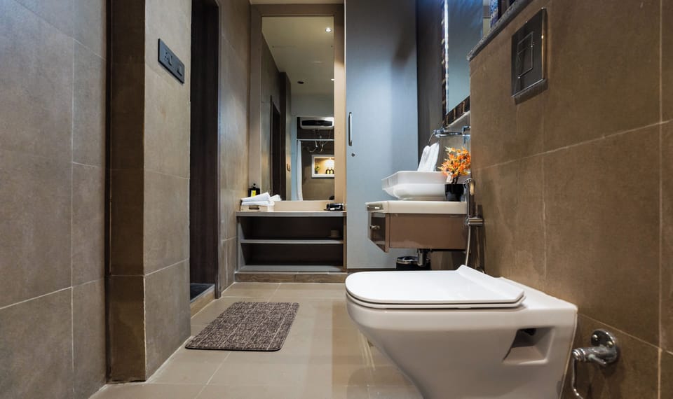 Executive Room, Pool View | Bathroom | Shower, slippers, towels, soap