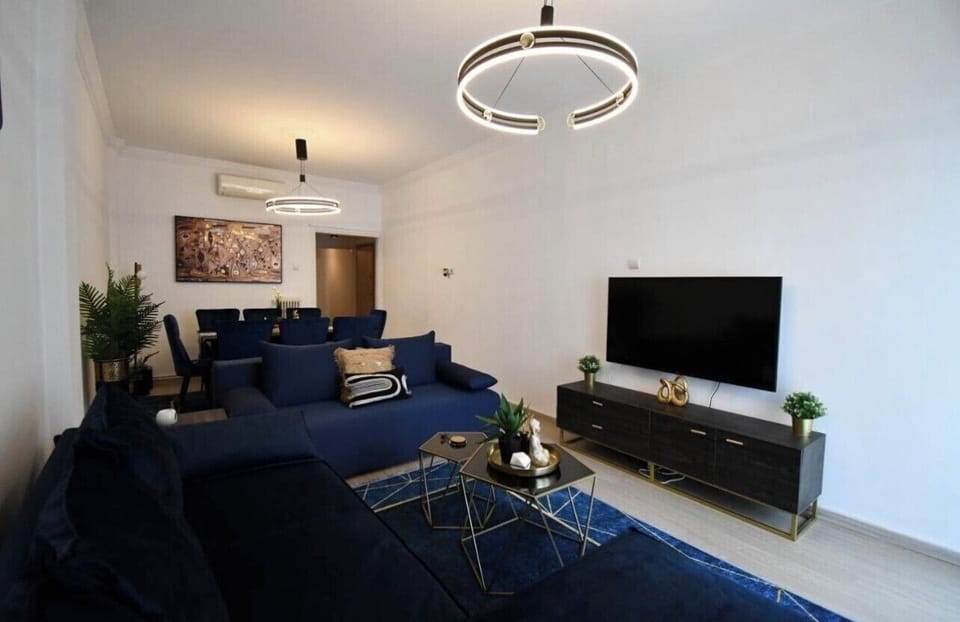Apartment, 3 Bedrooms | Living area | Flat-screen TV